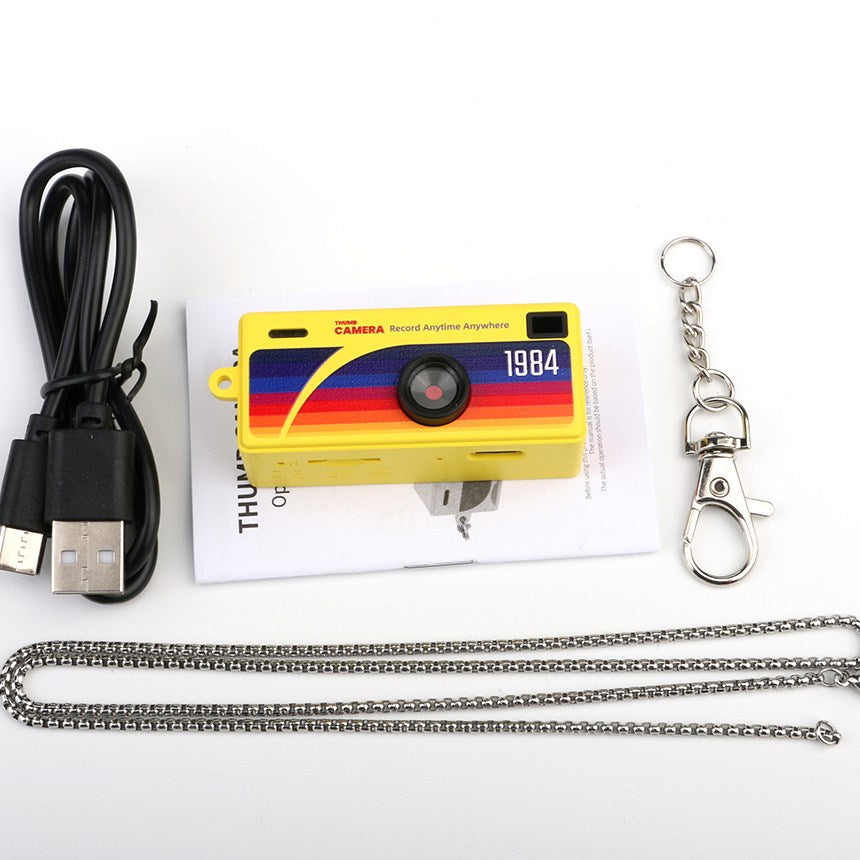 The yellow G6 with a USB cable, user manual, keyring clip and chain